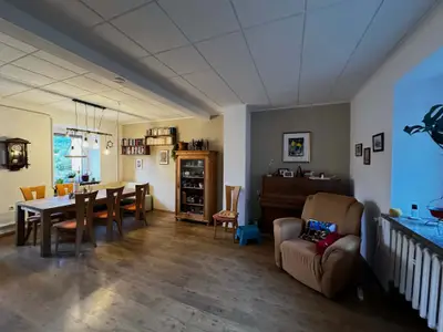 Himmelsscheibe living area with armchair and piano