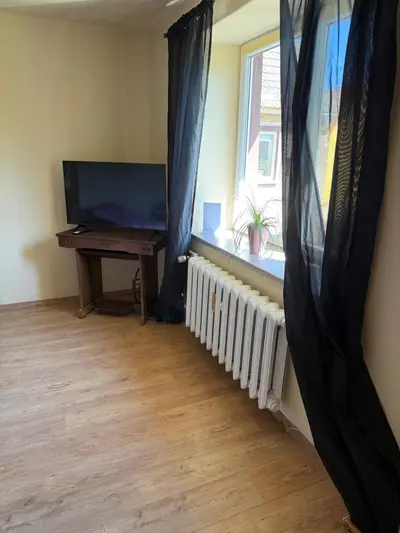 Himmelswege window with curtains and TV